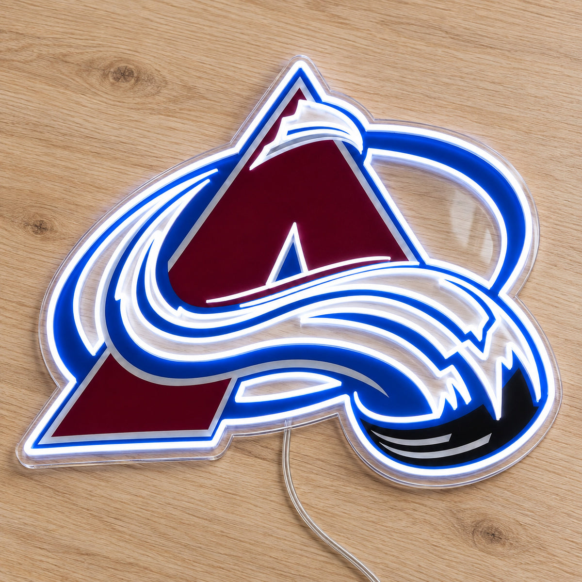 Colorado Avalanche LED Neon Sign, featuring team logo displayed on a wooden surface.
