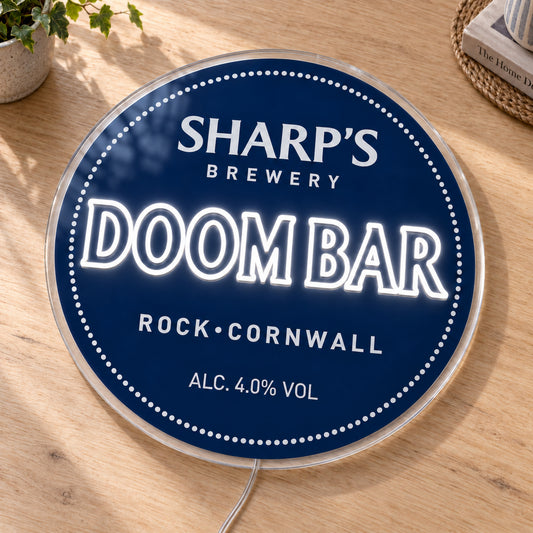Doom Bar LED Neon Sign, featuring beer-brand logo displayed on a wooden surface.