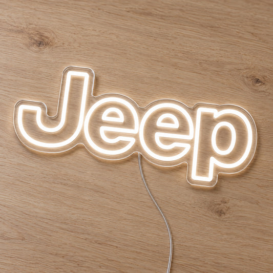 Jeep LED Neon Sign, featuring illuminated vehicle logo on a wooden surface.