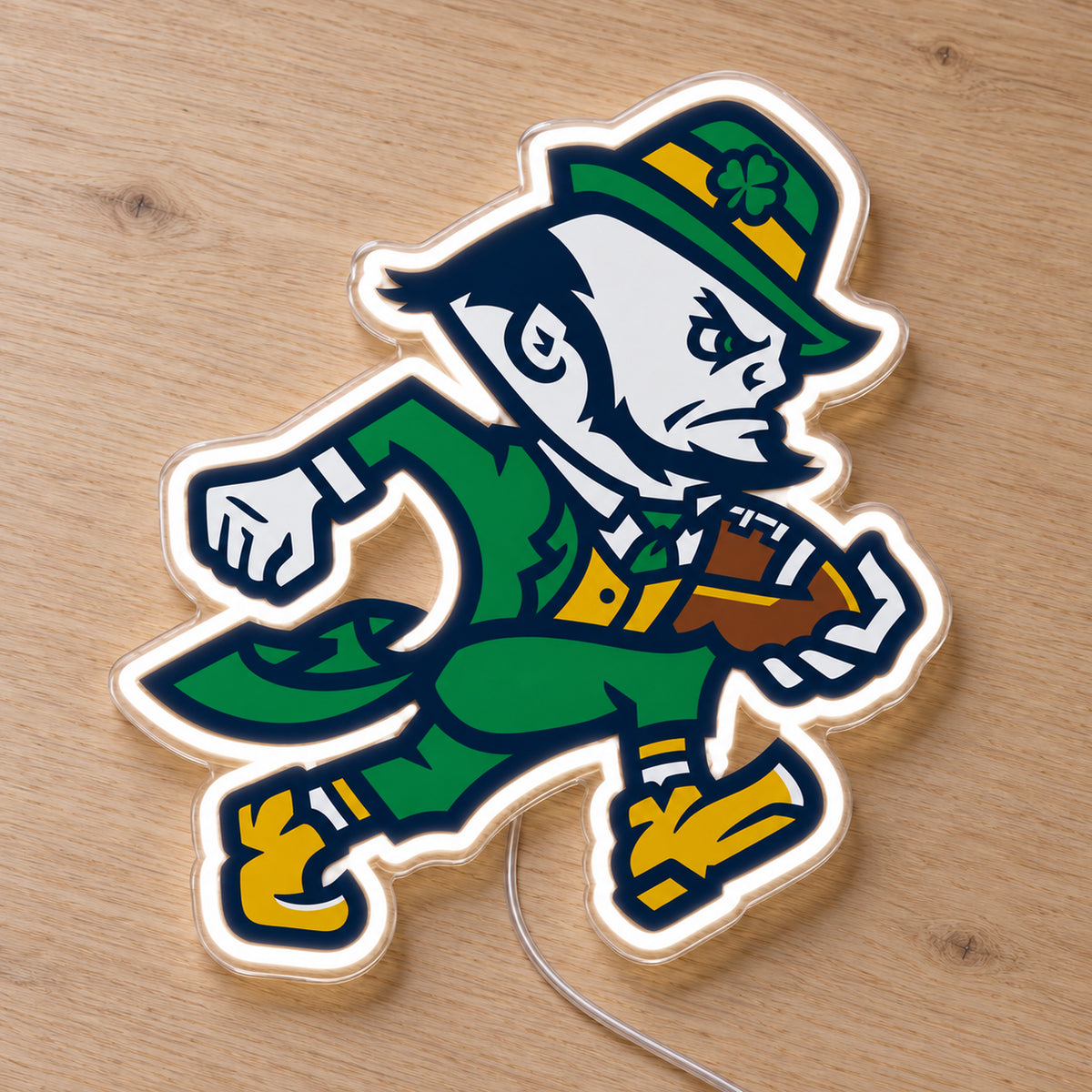 Notre Dame LED Neon Sign, featuring team logo displayed on a wooden surface.