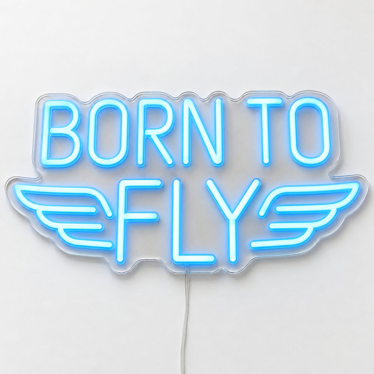 Born to Fly Neon Sign, featuring Born to Fly lettering with an aviation motif, on a single clear acrylic backing displayed on a white surface.