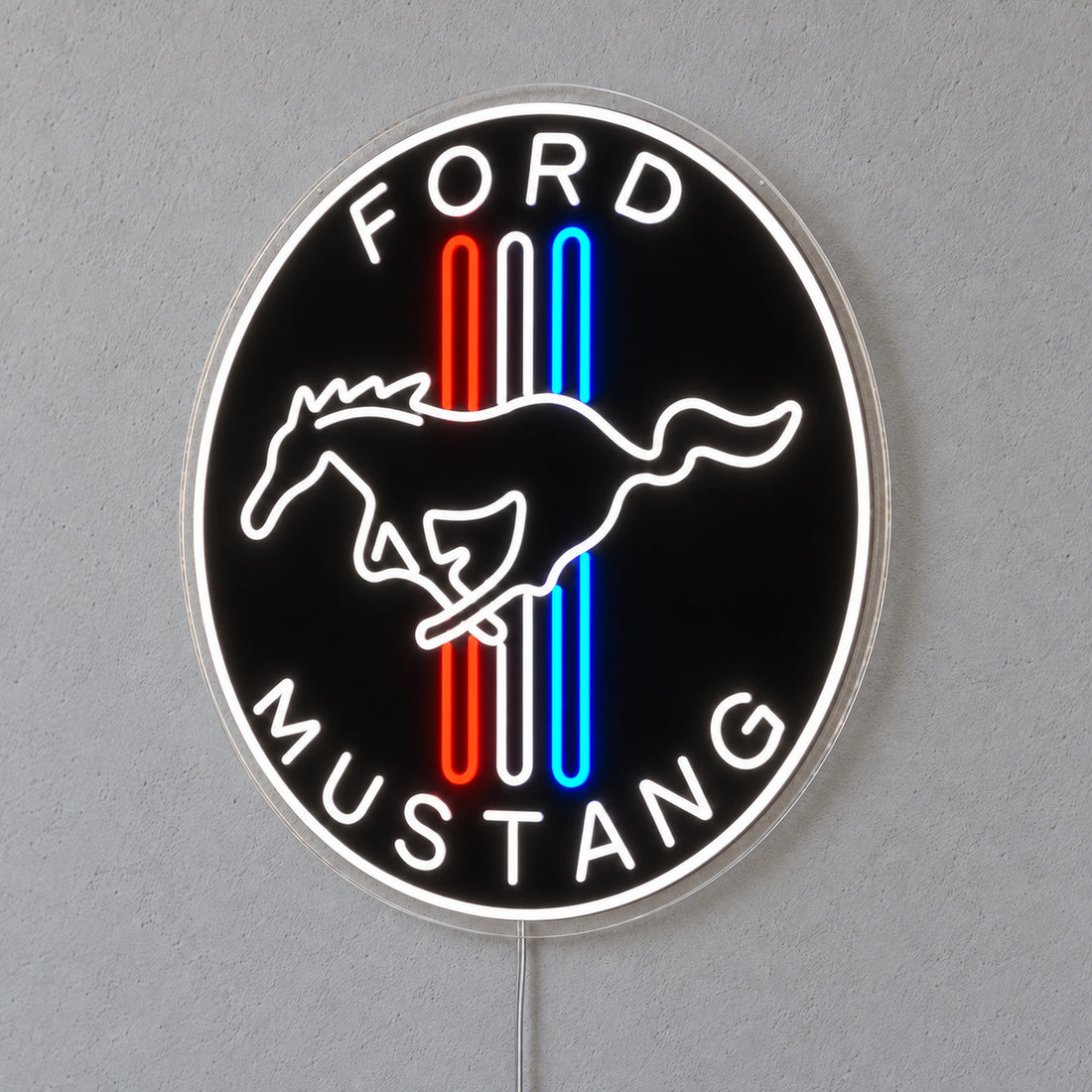 Ford Mustang Badge LED Neon Sign in red, white and blue, featuring a circular Ford Mustang horse badge on a grey wall.