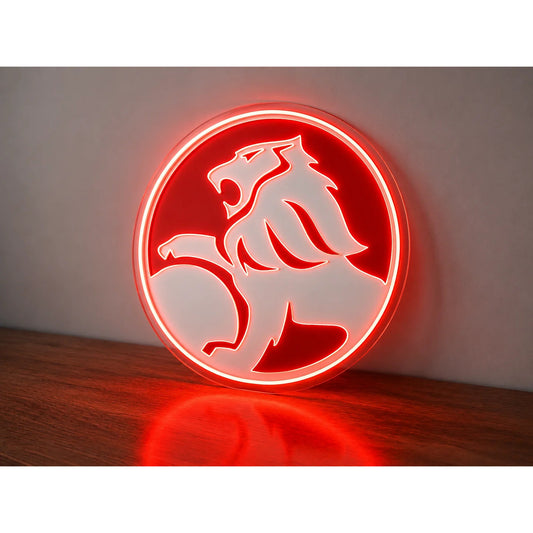 Holden Old Logo Neon Sign in red and white, featuring Holden lion emblem standing on a wooden surface.