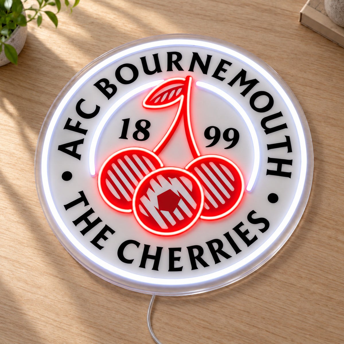 AFC Bournemouth LED Neon Sign, featuring team logo displayed on a wooden surface.