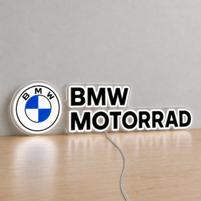 BMW Motorrad LED Neon Sign, featuring illuminated vehicle logo on a wooden surface.