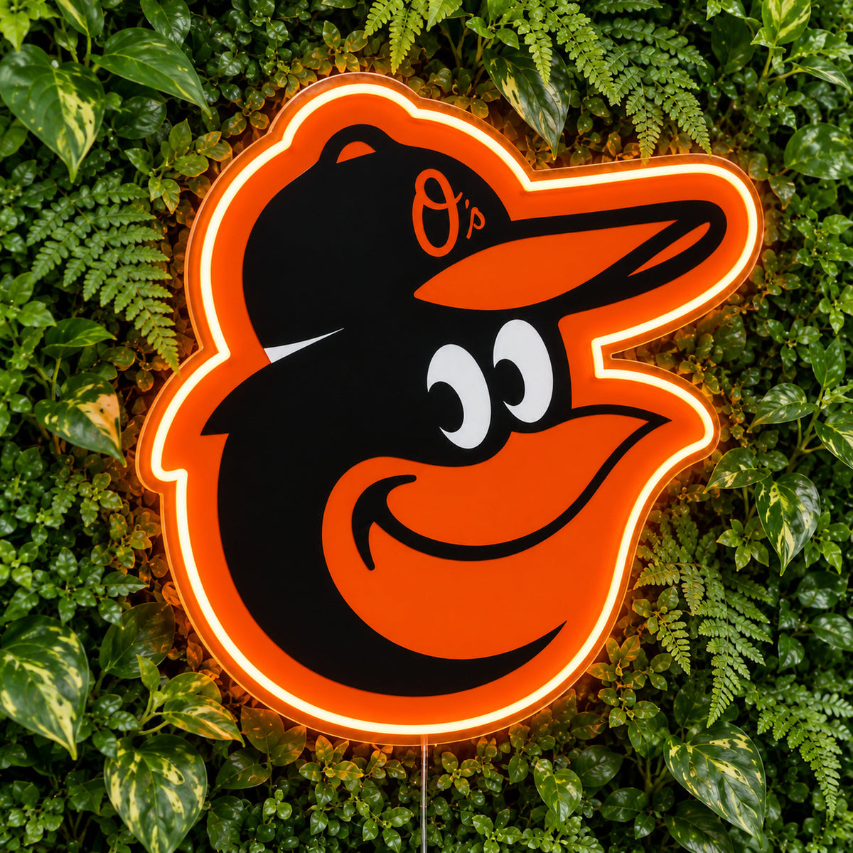 Baltimore Orioles LED Neon Sign, featuring illuminated team logo on a green foliage wall.