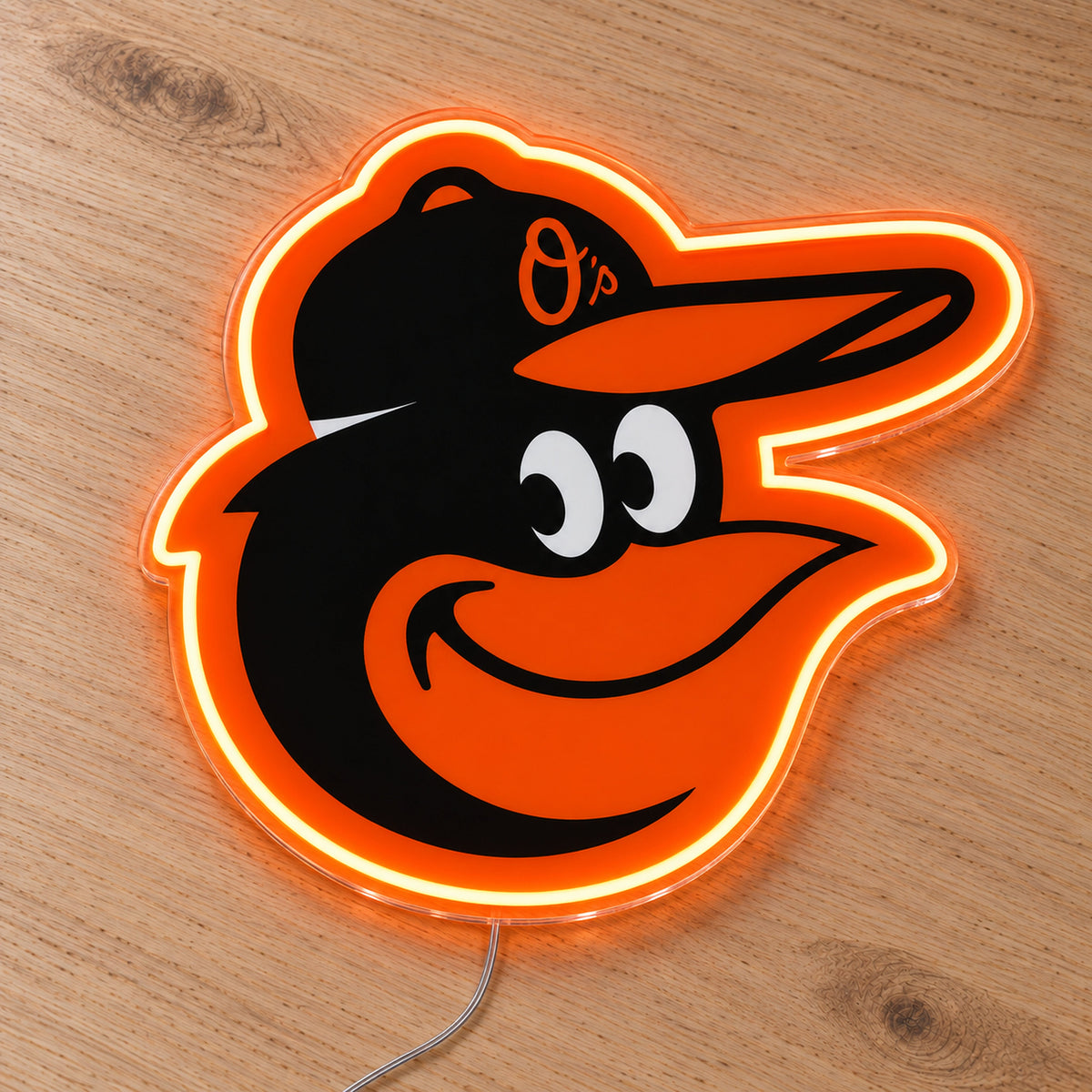 Baltimore Orioles LED Neon Sign, featuring illuminated team logo on a wooden surface.