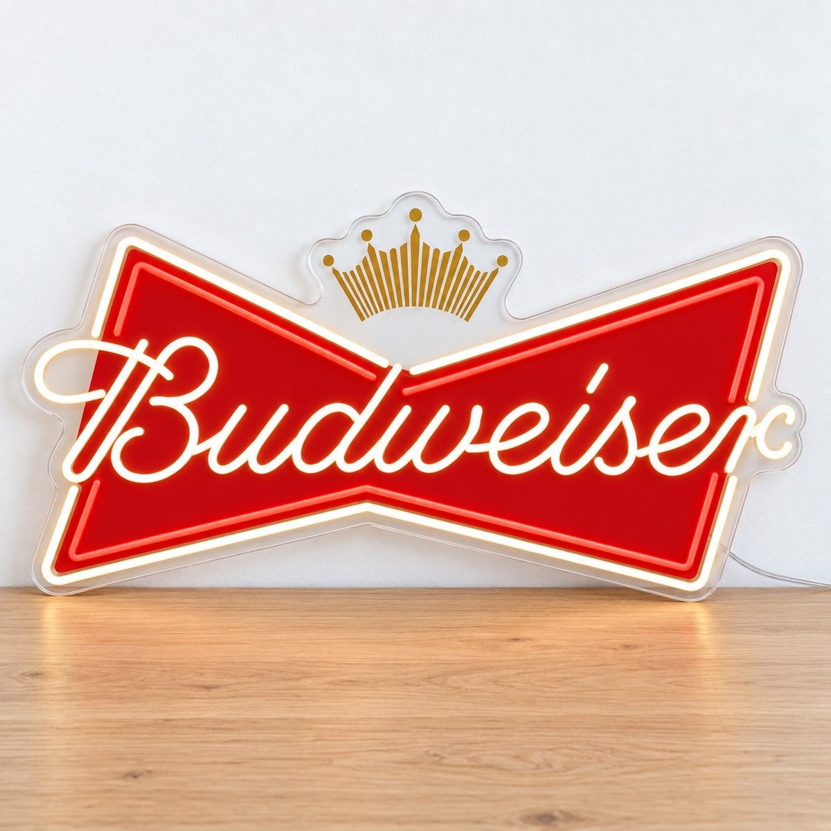 Budweiser LED Neon Sign, featuring illuminated beer-brand logo on a wooden surface.