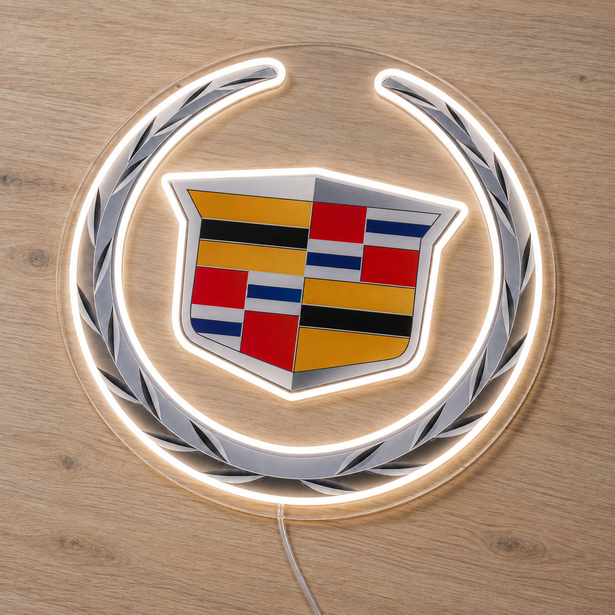 Cadillac LED Neon Sign, featuring illuminated vehicle logo on a wooden surface.