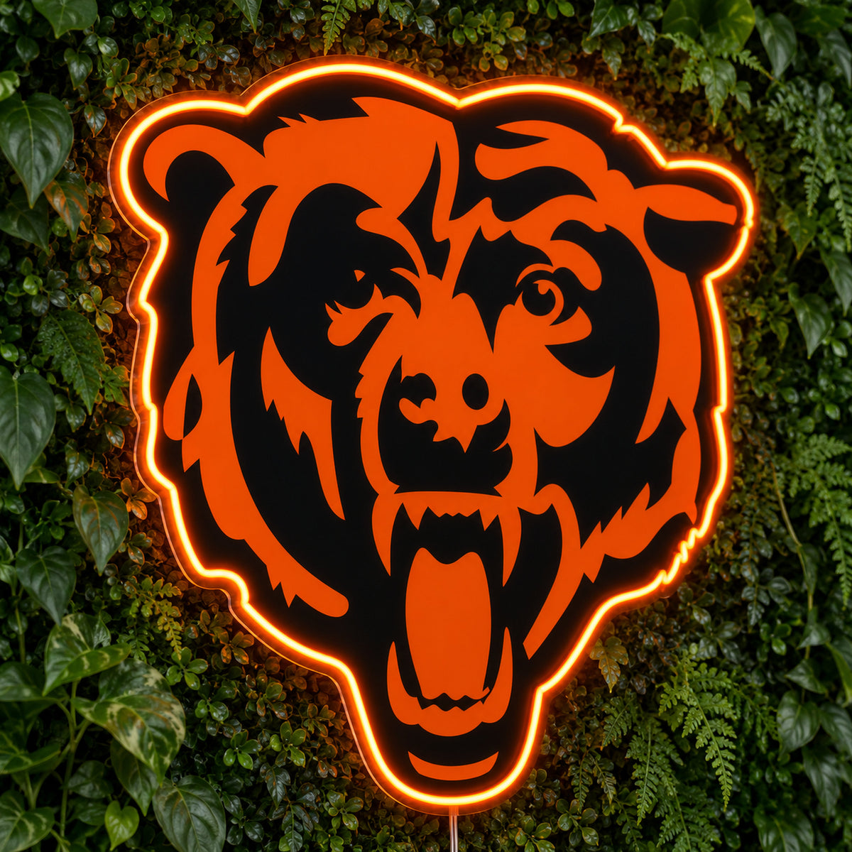 Chicago Bears LED Neon Sign, featuring illuminated team logo on a green foliage wall.