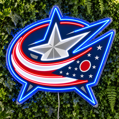 Columbus Blue Jackets LED Neon Sign, featuring team logo displayed on a green foliage wall.