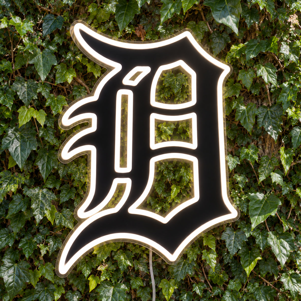 Detroit Tigers LED Neon Sign, featuring team logo displayed on a green foliage wall.
