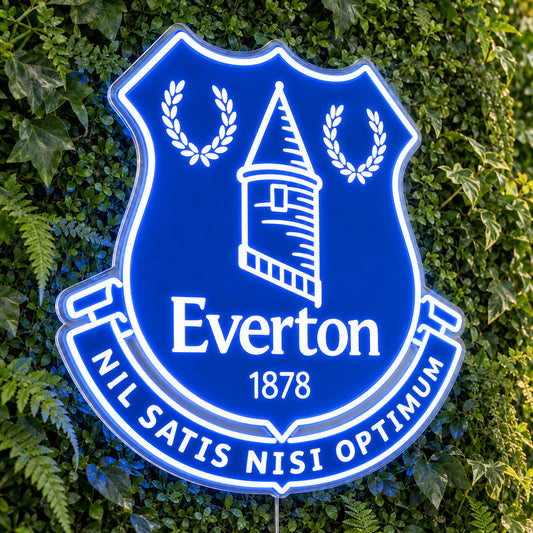 Everton LED Neon Sign, featuring team logo displayed on a green foliage wall.