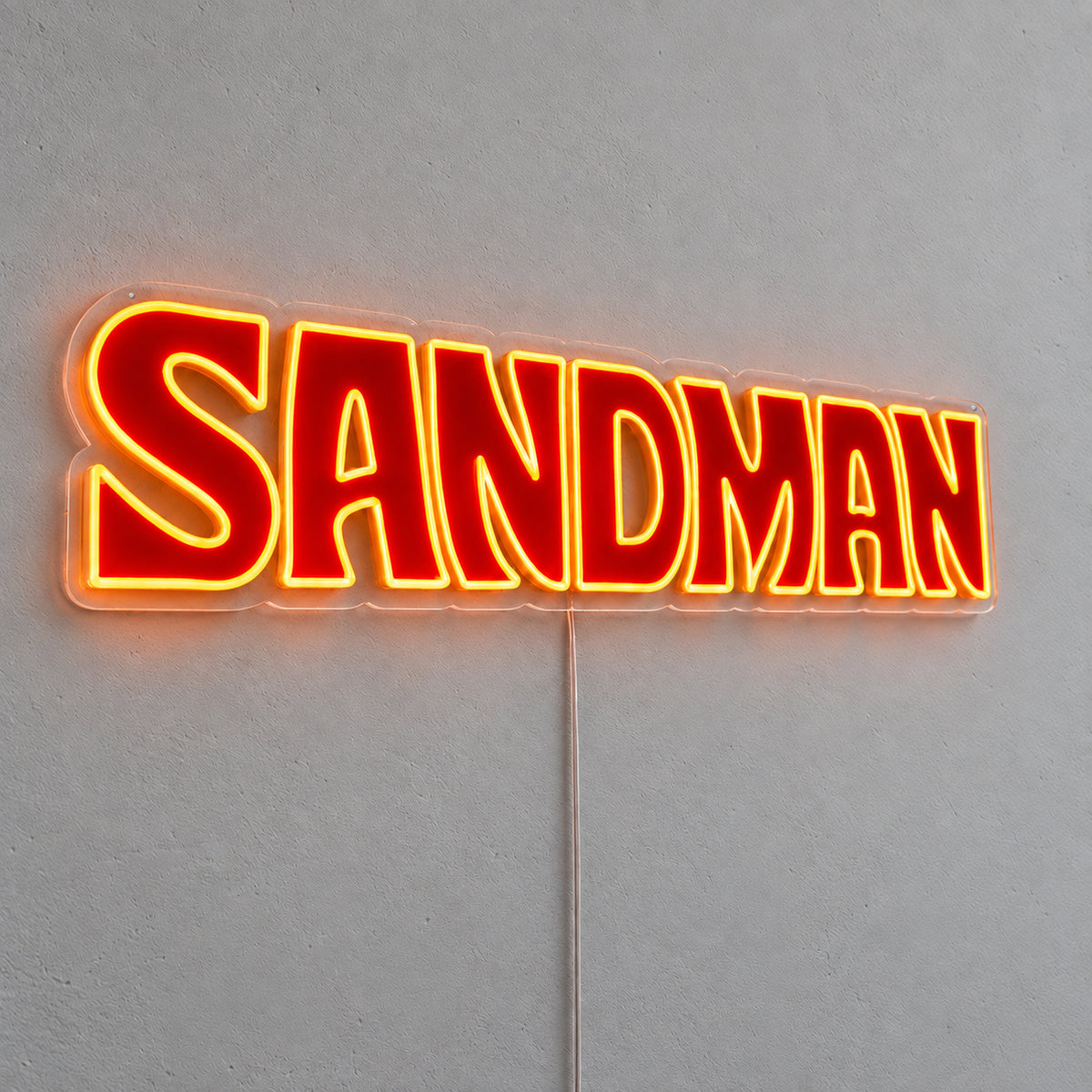 Holden Sandman Style LED Neon Sign in red and yellow, featuring Sandman lettering on a grey wall.