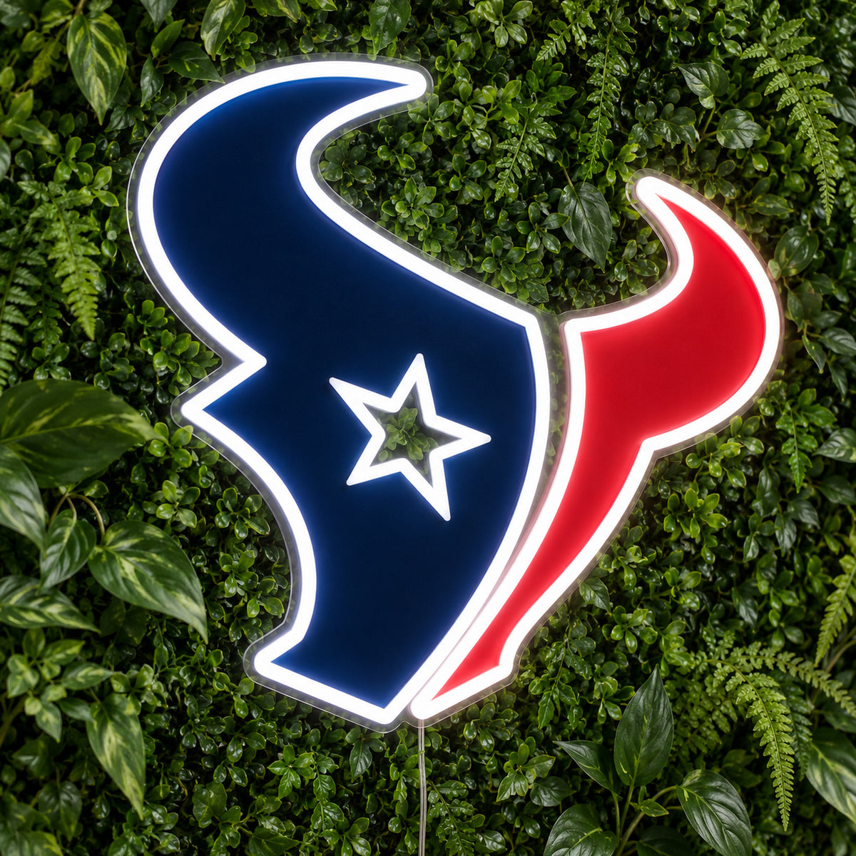 Houston Texans LED Neon Sign, featuring team logo displayed on a green foliage wall.