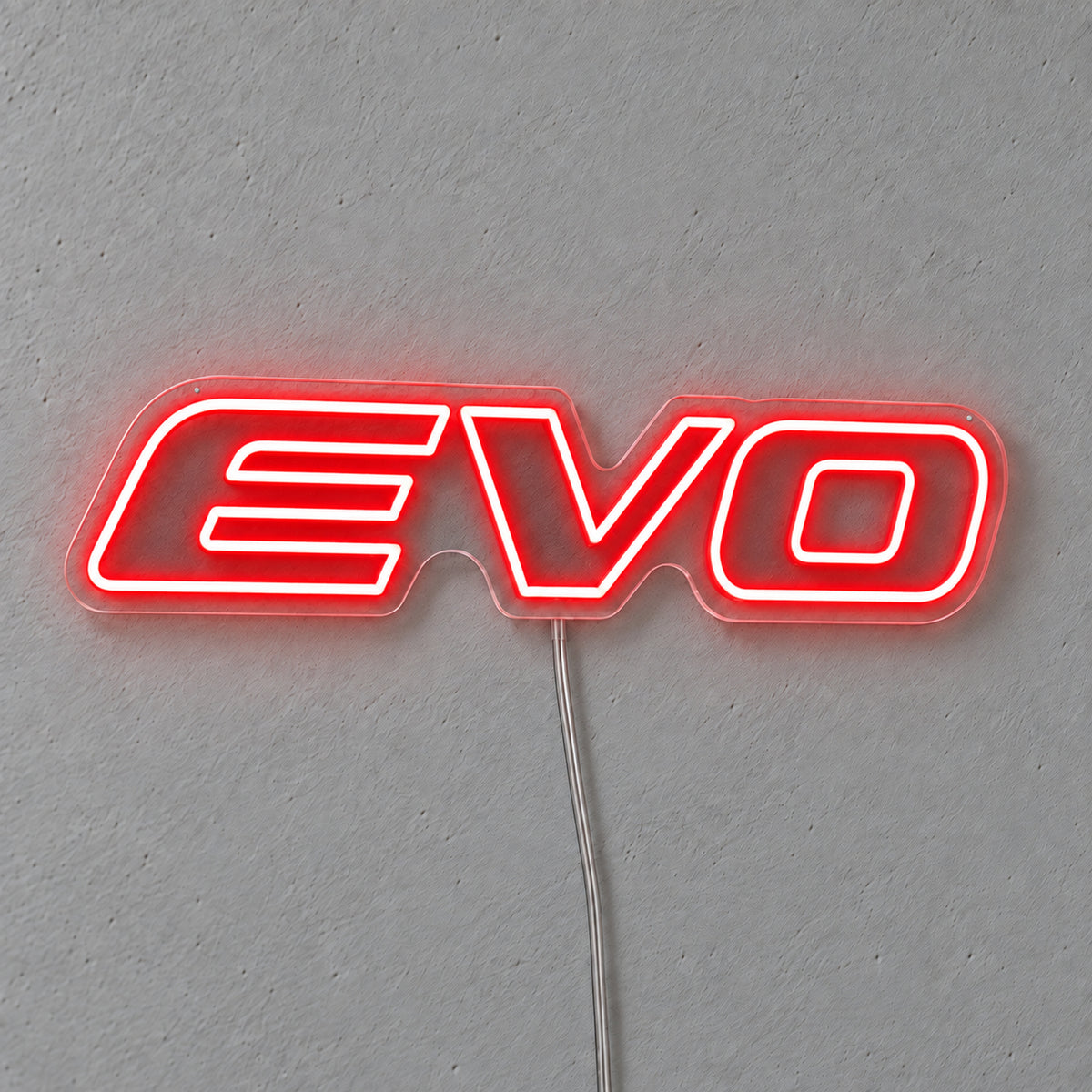 Mitsubishi Evo Logo LED Neon Sign in red, featuring Evo lettering on a grey wall.