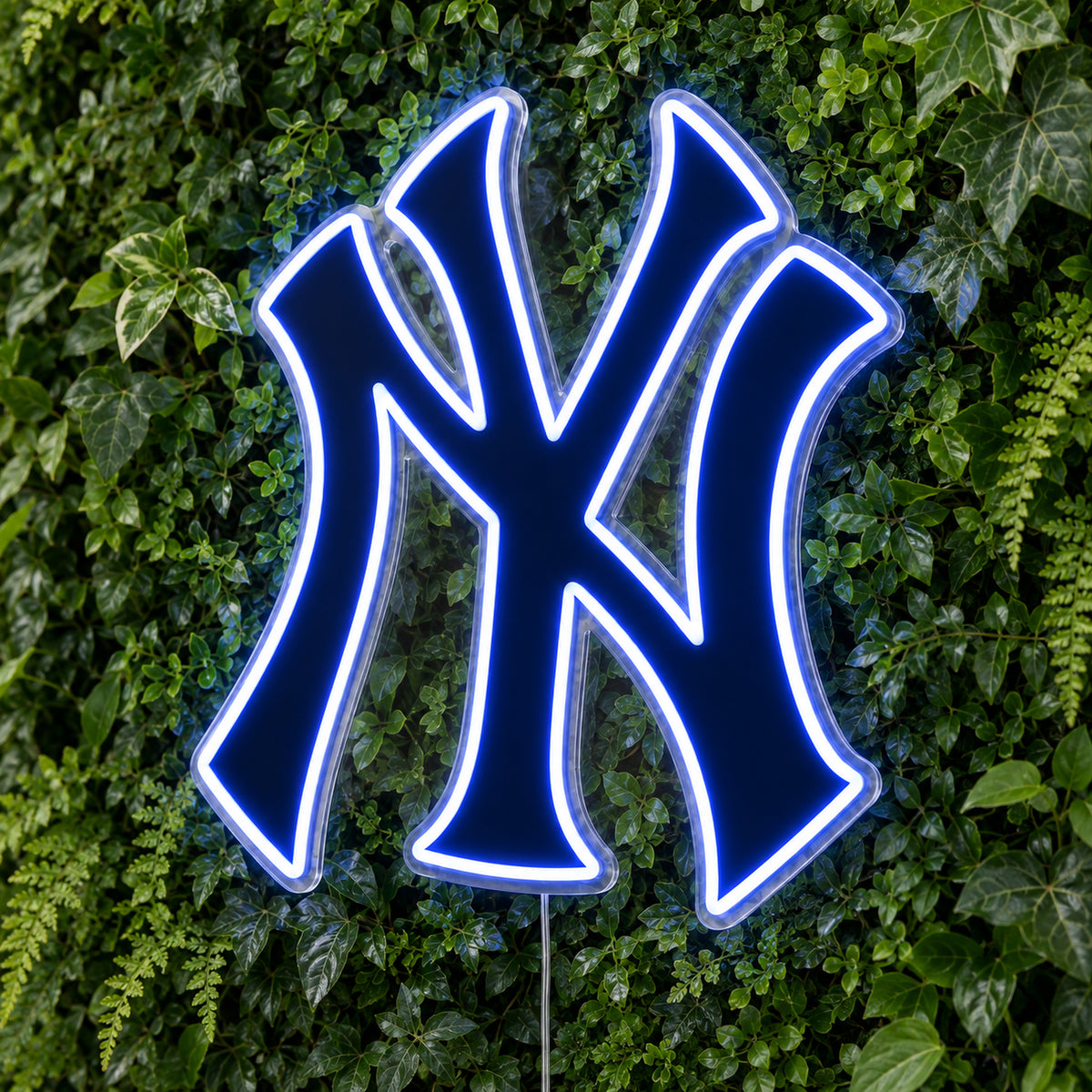 New York Yankees LED Neon Sign, featuring team logo displayed on a green foliage wall.