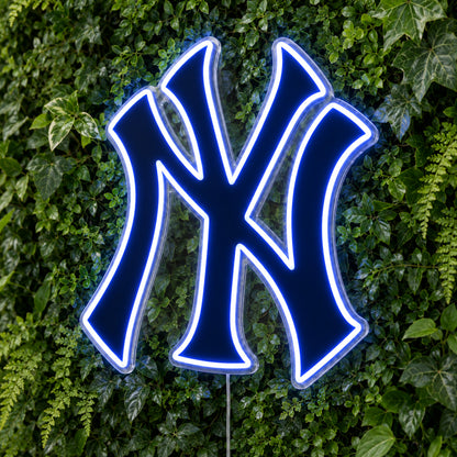 New York Yankees LED Neon Sign, featuring team logo displayed on a green foliage wall.