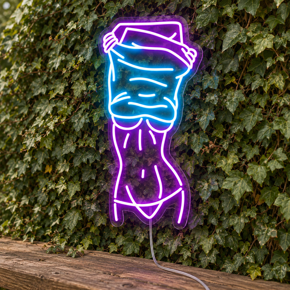 Nude Lady Man Cave Neon Sign - Garage & Home Bar Wall Sign in purple and turquoise, featuring a woman's outline against a foliage wall.