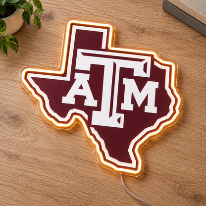 Texas A&M Aggies LED Neon Sign, featuring team logo displayed on a wooden surface.