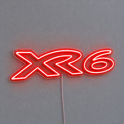 XR6 Ford Falcon LED Neon Sign in red, featuring XR6 lettering on a grey wall.