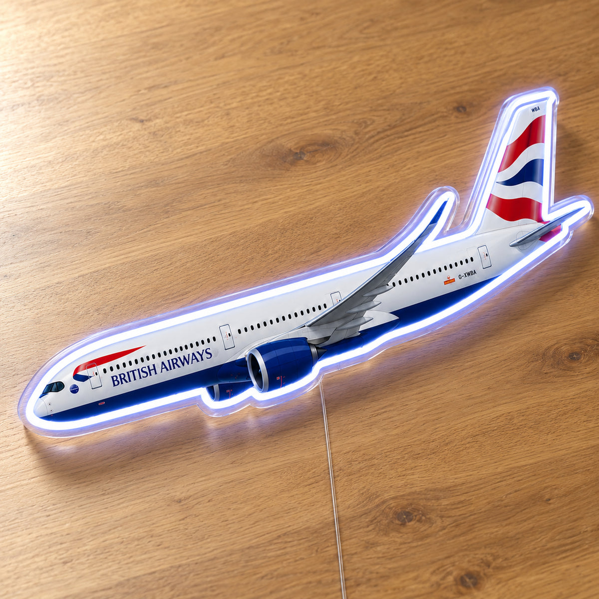 Airbus A350-1000 British Airways Neon Sign with printed aircraft details and an illuminated LED outline on clear acrylic, shown on a wooden surface, registration G-XWBA