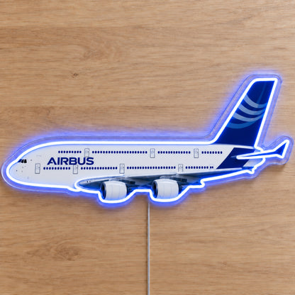 Airbus A380 Neon Sign with printed aircraft details and an illuminated LED outline on clear acrylic, shown on a wooden surface