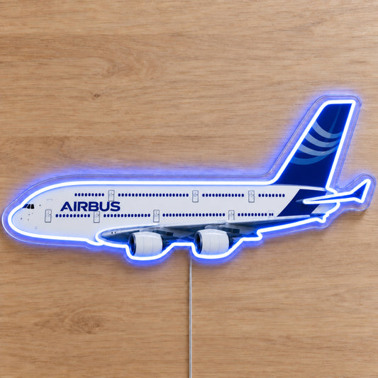 Airbus A380 Neon Sign with printed aircraft details and an illuminated LED outline on clear acrylic, shown on a wooden surface