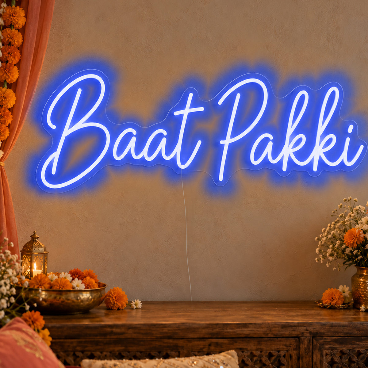Baat Pakki Neon Sign in blue LED neon on clear acrylic, angled view