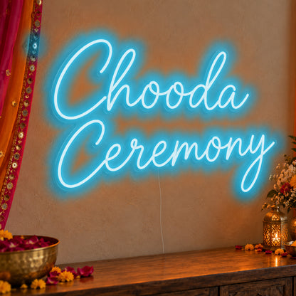 Chooda Ceremony Neon Sign in ice blue LED neon on clear acrylic, angled view