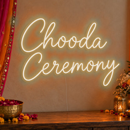 Chooda Ceremony Neon Sign in warm white LED neon on clear acrylic, angled view