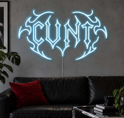 Cunt Neon Sign in Ice Blue LED neon with double outlined C, displayed above a black leather sofa.