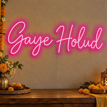 Gaye Holud Neon Sign in rose red LED neon on clear acrylic, angled view