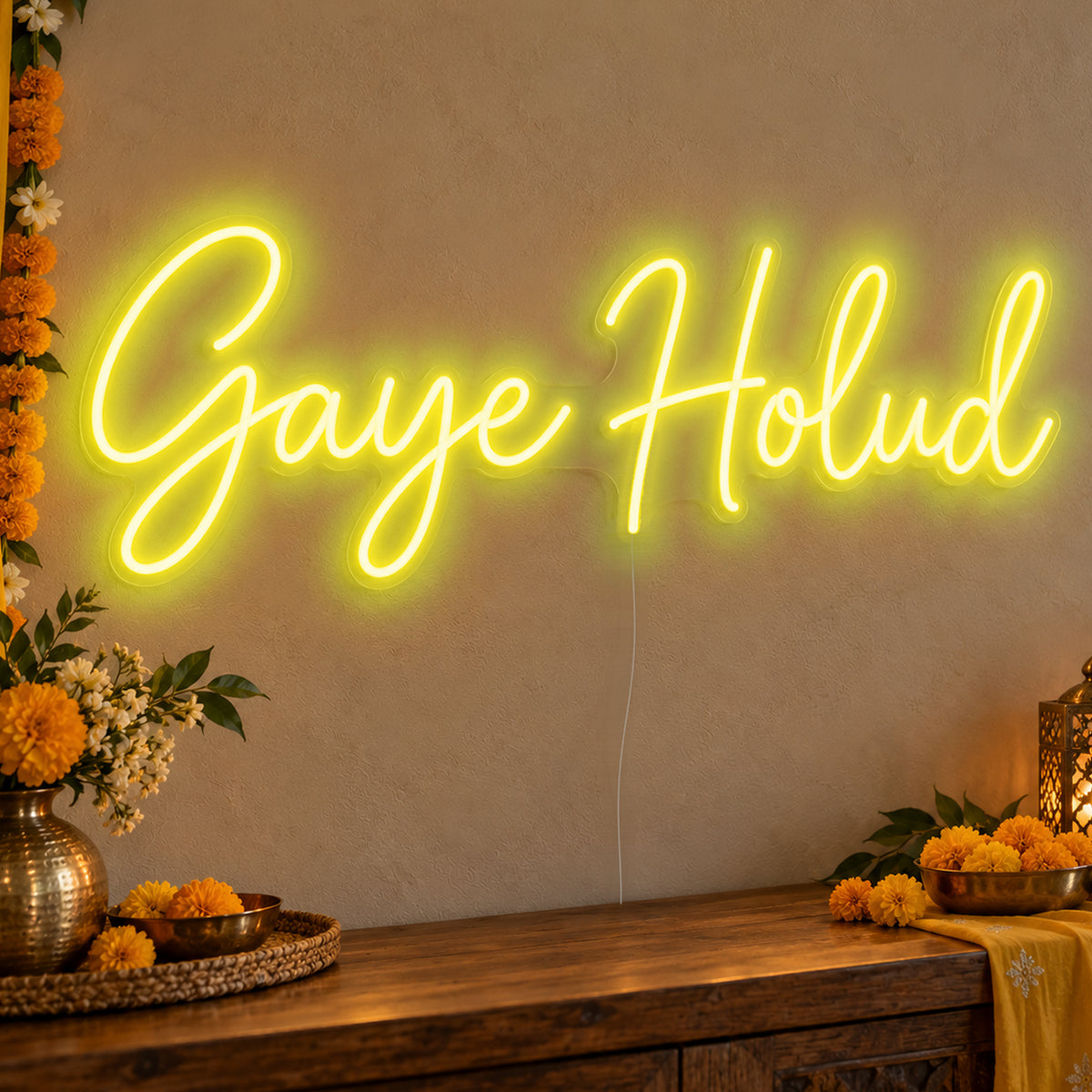 Gaye Holud Neon Sign in yellow LED neon on clear acrylic, angled view