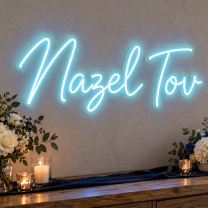 Mazel Tov Blue Neon Sign in ice blue LED neon on clear acrylic, angled view