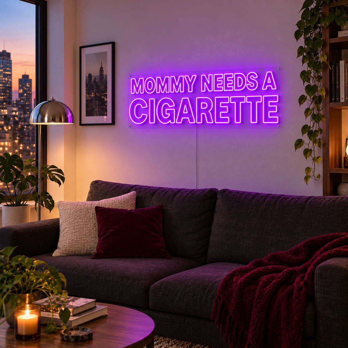 Mommy Needs A Cigarette Neon Sign with purple lighting, displayed above a brown sofa.