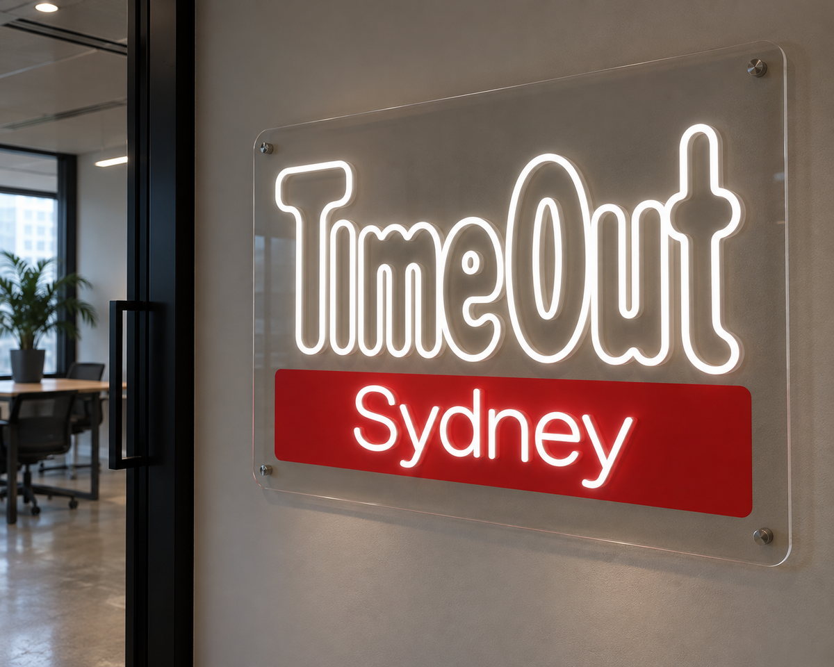 White TimeOut Sydney LED neon sign on clear acrylic, shown as custom sign inspiration for Darlinghurst.