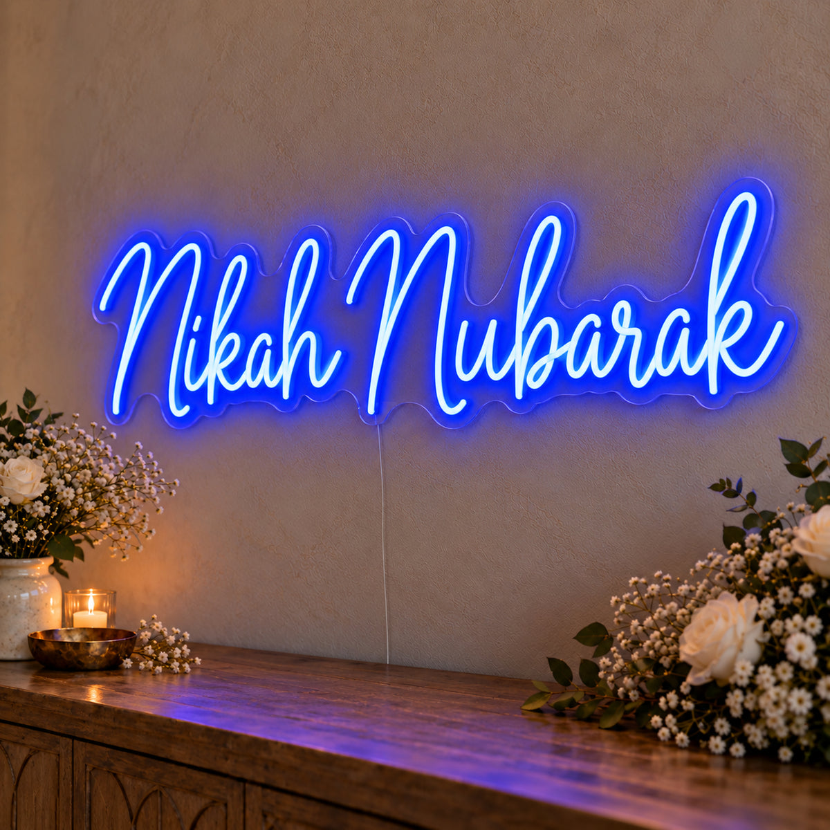 Nikah Mubarak Neon Sign in blue LED neon on clear acrylic, angled view