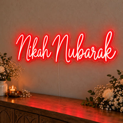 Nikah Mubarak Neon Sign in red LED neon on clear acrylic, angled view