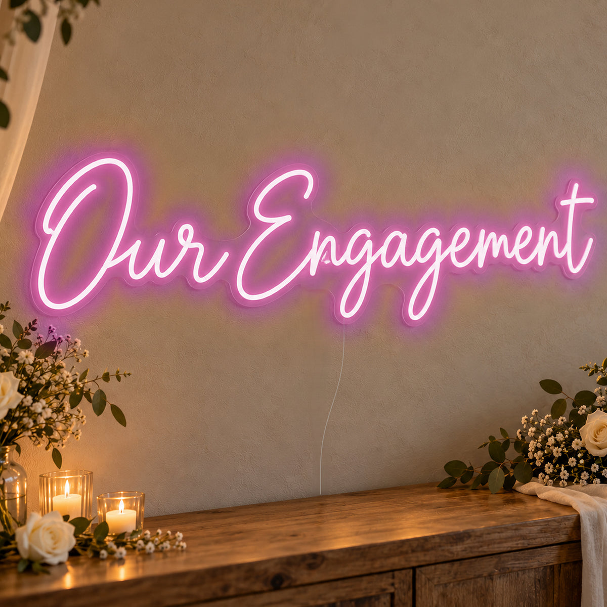 Our Engagement Neon Sign in pink LED neon on clear acrylic, angled view
