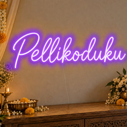 Pellikoduku Neon Sign in purple LED neon on clear acrylic, angled view