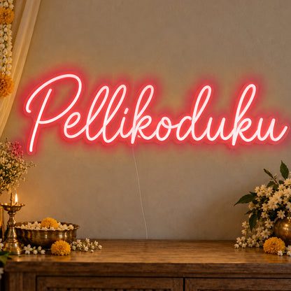Pellikoduku Neon Sign in red LED neon on clear acrylic, angled view