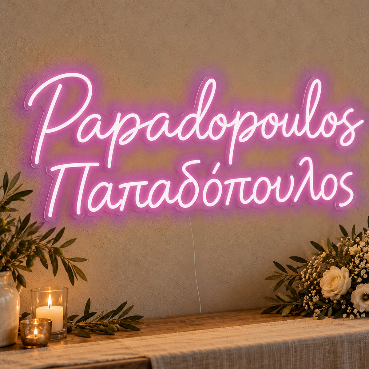 Personalised Bilingual Greek Surname Neon Sign in pink LED neon on clear acrylic, angled view