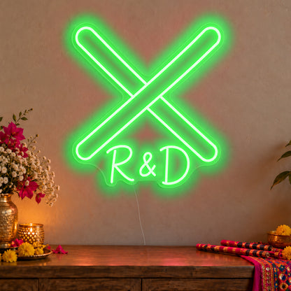 Personalised Dandiya Initials Neon Sign in green LED neon on clear acrylic, angled view