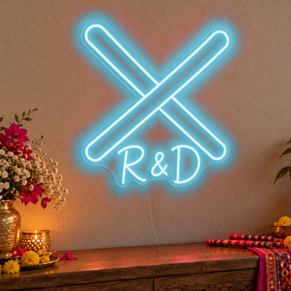 Personalised Dandiya Initials Neon Sign in ice blue LED neon on clear acrylic, angled view