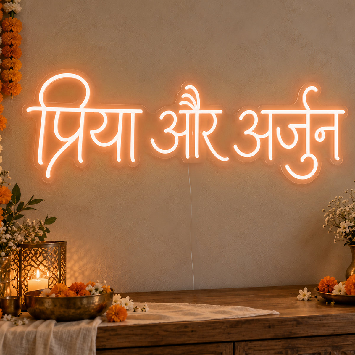 Personalised Devanagari Couple Names Neon Sign in orange LED neon on clear acrylic, angled view