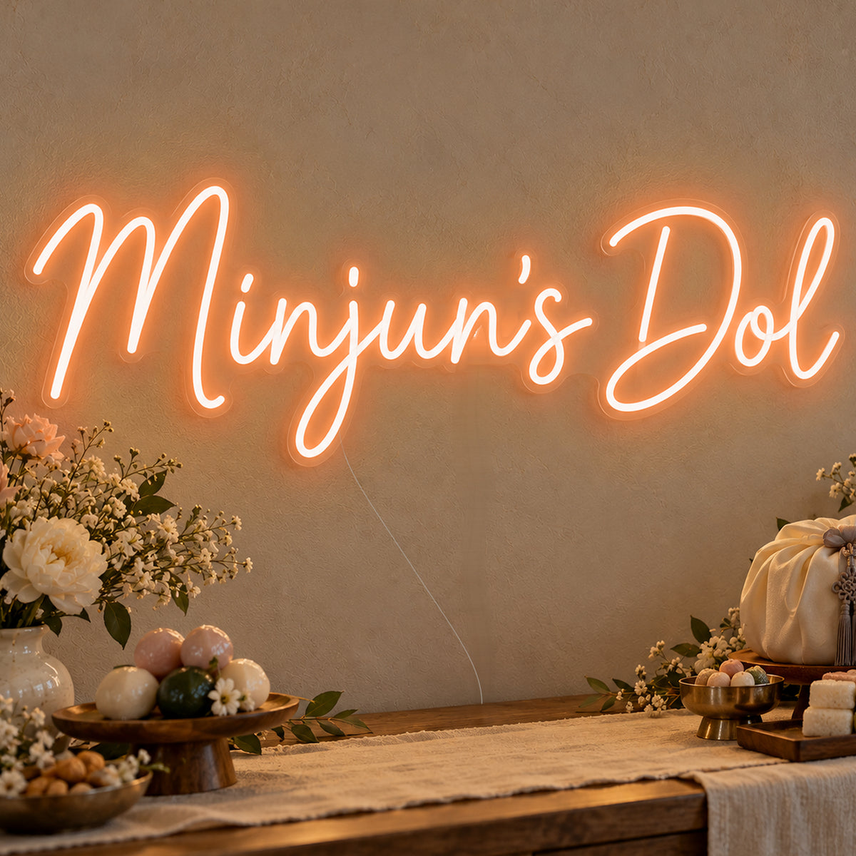 Personalised Dol Neon Sign in orange LED neon on clear acrylic, angled view