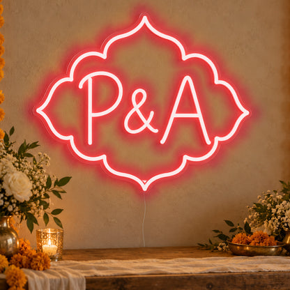 Personalised Marigold Initials Neon Sign in red LED neon on clear acrylic, angled view