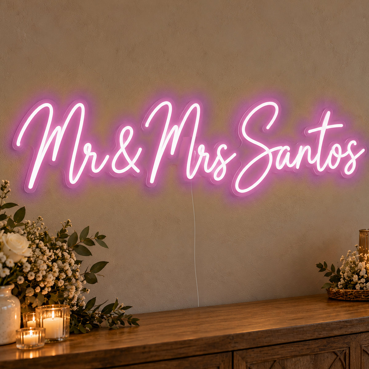 Personalised Mr & Mrs Surname Neon Sign in pink LED neon on clear acrylic, angled view