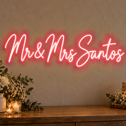 Personalised Mr & Mrs Surname Neon Sign in red LED neon on clear acrylic, angled view
